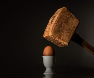 A hammer breaking an egg - you don't want fragile items broken.