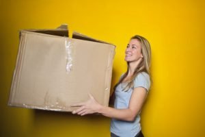 Image of a woman holding a box