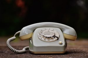 An old telephone; dark background