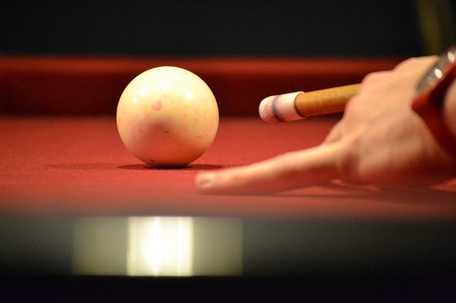A person playing pool.