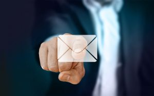 a man pointing out an email icon