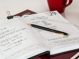 A notebook with a plan about relocating a small business