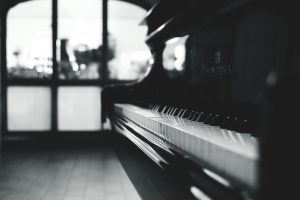 a black piano inside the room