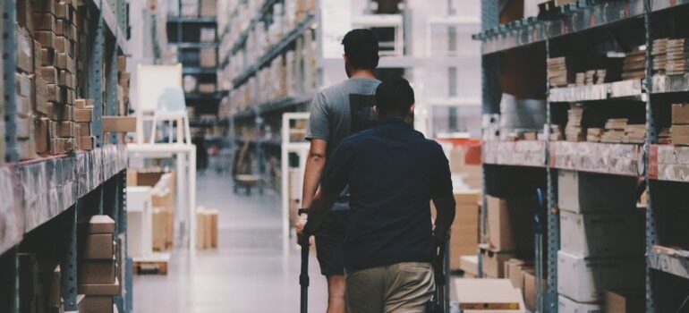 two people going through storage, warehouse