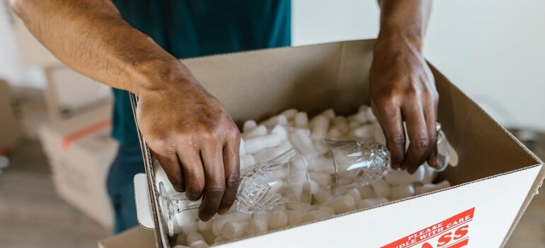 professional mover packing glassware 