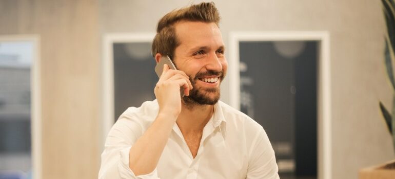 a person talking on a phone, smiling