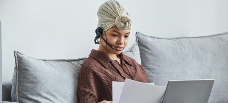 woman using a headset to communicate over the internet