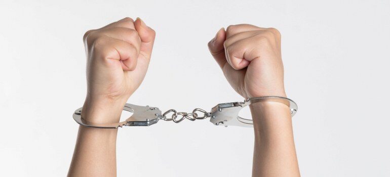 handcuffs, representing why West Virginia is one of the states people are leaving 2021