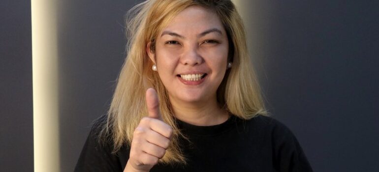 a woman giving a thumbs up
