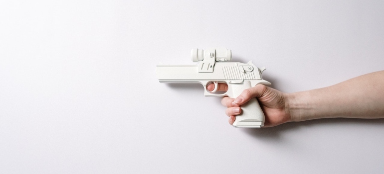 A person holding a toy gun