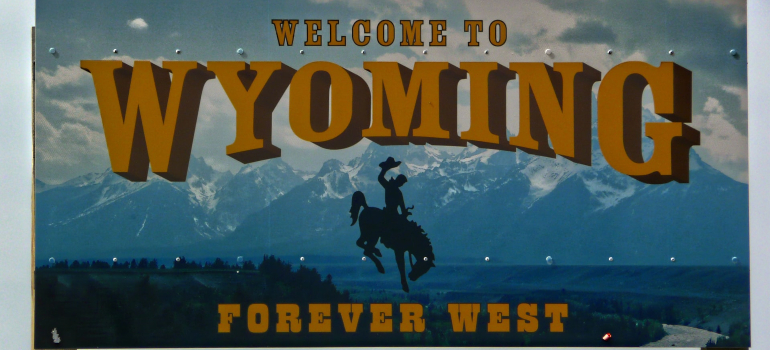a welcoming billboard that welcomes people into Wyoming