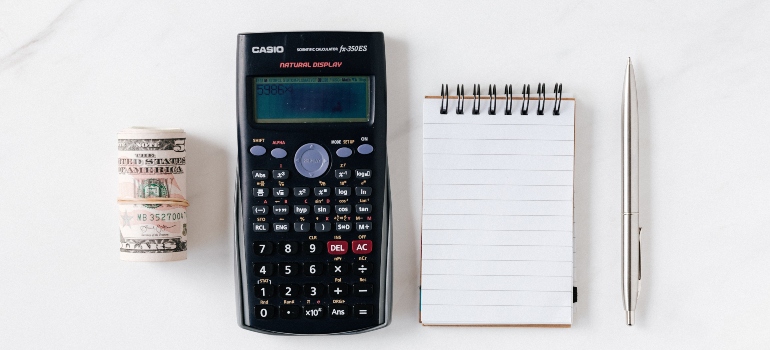 money, calculator, pen and paper 