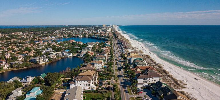 Aerial View of Houses Near A Beach Under Blue Sky - Moving from Nebraska to Florida.