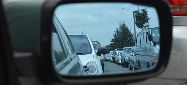 Car Side Mirror Showing Heavy Traffic.