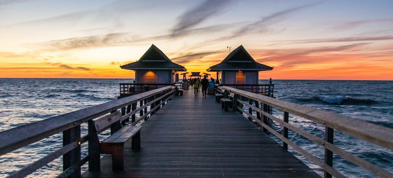 A pier in Naples FL after sunset.