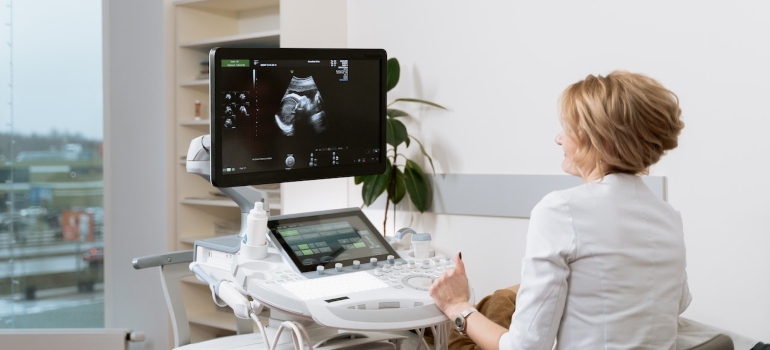 a doctor looking at an ultrasound 