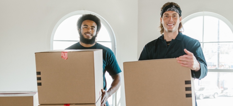 Professional movers carrying boxes.