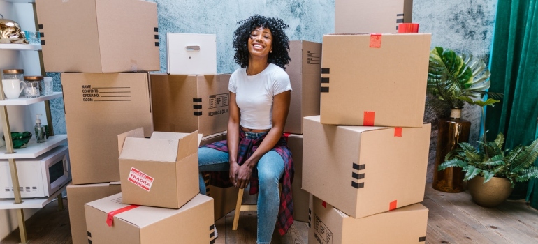 A woman surrounded by boxes