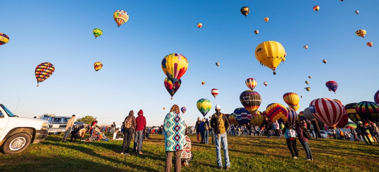 People waiting for a balloon ride in one of the best mountain towns to visit in the USA
