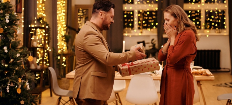a couple exchanging Christmas presents.