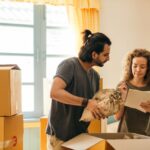 two people checking the legitimate ways movers can increase your final cost