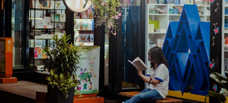 a person sitting and reading a book